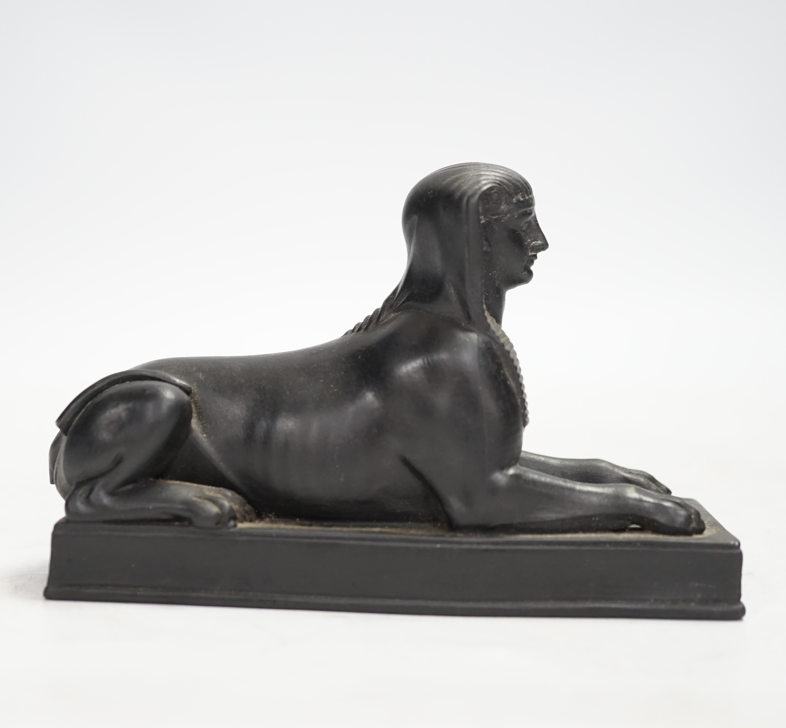 A 19th century Wedgwood basalt model of a sphinx. Condition - loss to tail, minor rubbing, fair